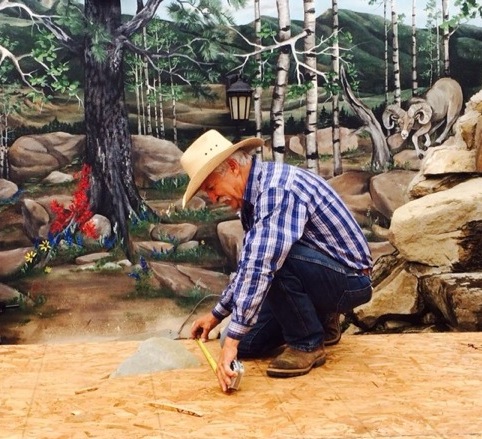 Dennis Russell building the stage for the first Cimarron Cowboy Music and Poetry Gathering, 2014